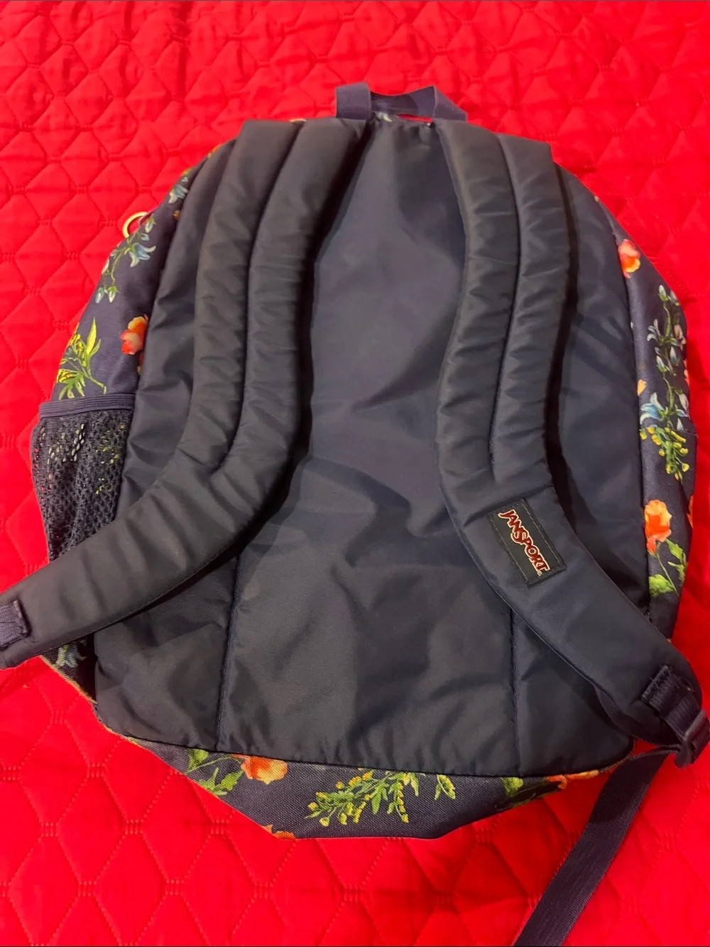 Jansport Navy Backpack with Colorful Floral Print